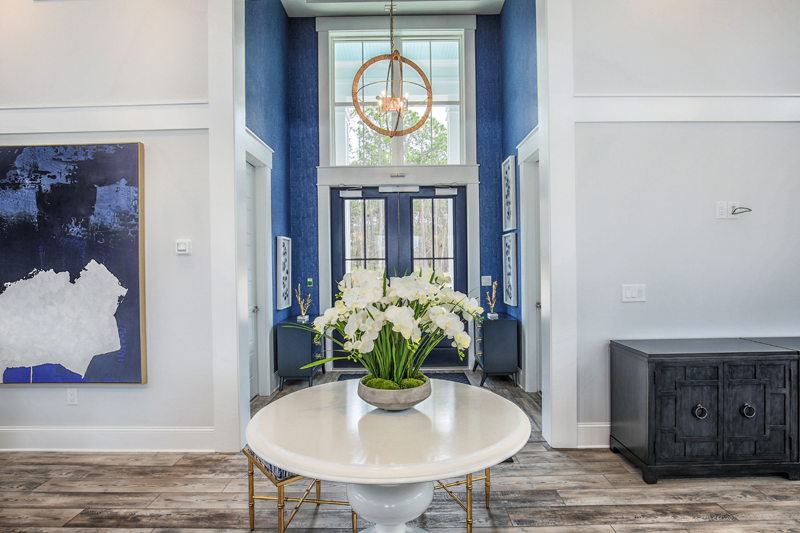 Royal Blue Doors with white orchids and marble table home design